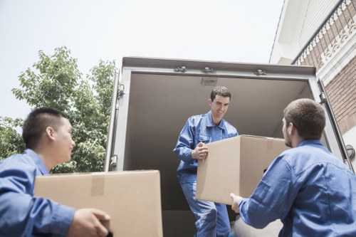 Packed moving boxes and furniture ready for transport in a Harringay home move