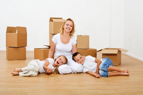 Packed household boxes and furniture prepared for house removals in Harringay