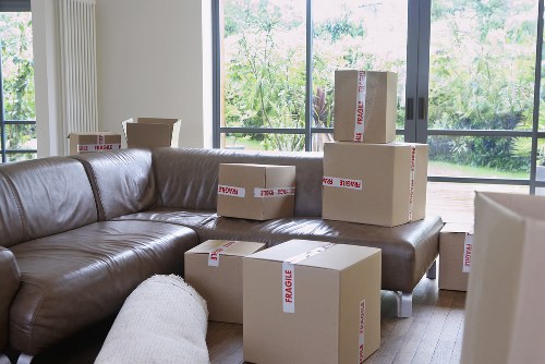 Local removals team transporting belongings from an apartment building